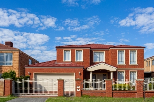 red brick house front of two storey home in Victoria - Australian Stock Image