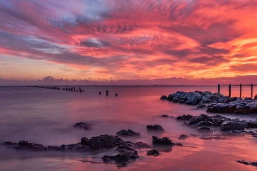 Red sunrise at Bridport Old Pier, Tasmania - built in 1916; destroyed by fire in 1941
