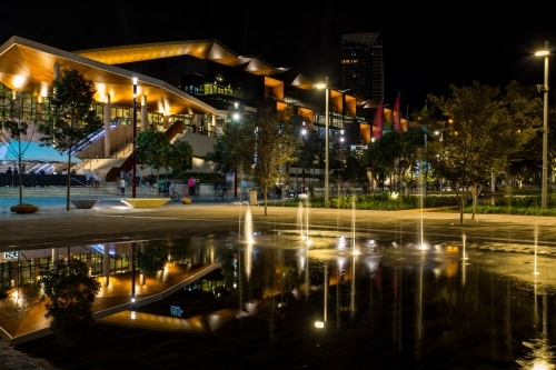 Reflection of the night lights in the forecourt fountain at Darling Harbour, Sydney - Australian Stock Image