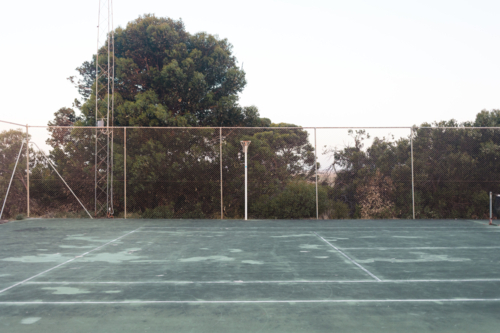 Regional Australia netball court surrounded by scrub - Australian Stock Image