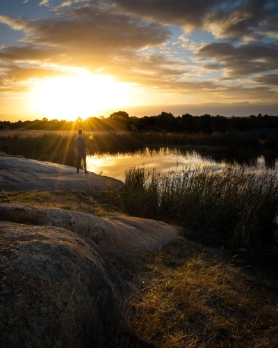 Relaxing Beside a Lake at Sunset - Australian Stock Image