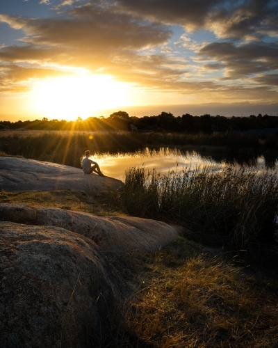 Relaxing Beside a Lake at Sunset - Australian Stock Image
