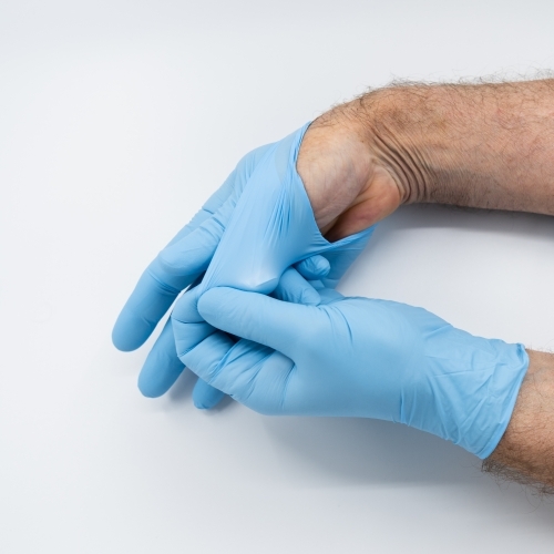 Removing blue medical gloves