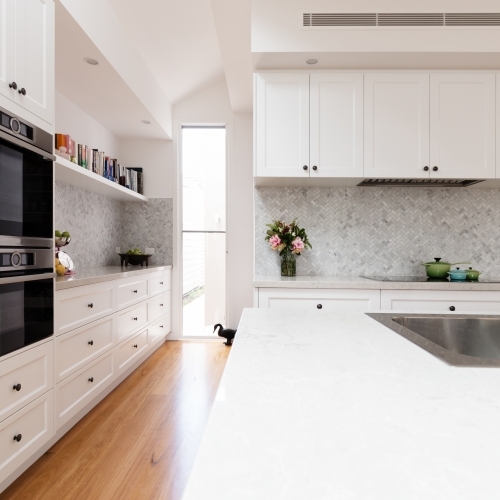 Renovated classic contemporary style kitchen in white and grey tones - Australian Stock Image