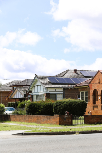 Residential house with solar panels on the roof. - Australian Stock Image