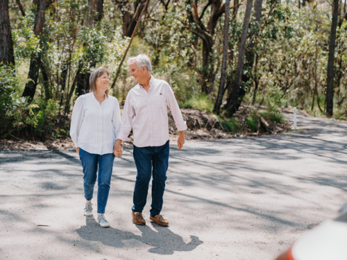 Retired senior couple enjoying a healthy lifestyle in nature - Australian Stock Image