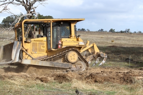 Ripping up rabbit burrows - Australian Stock Image