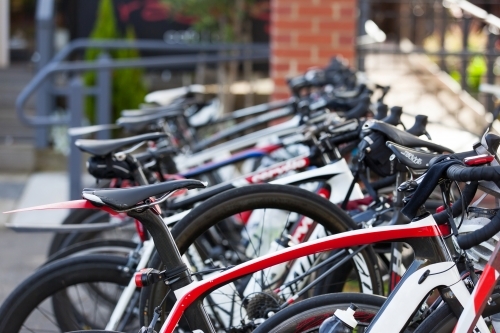 Road bikes on a rack at a cafe - Australian Stock Image