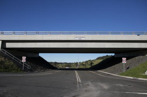 Road going under overpass with low clearance - Australian Stock Image
