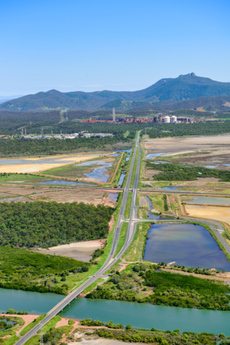 Road leading to industrial sites near Gladstone - Australian Stock Image