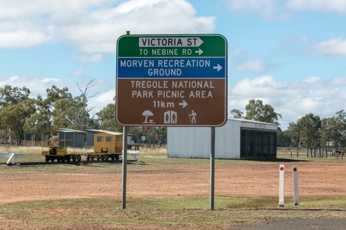 Road sign and structures in regional area - Australian Stock Image