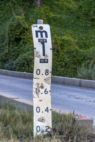 Road subject to flooding sign depth indicator - Australian Stock Image