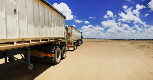 Road Train in bright sunlight in the outback - Australian Stock Image