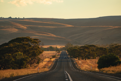 Road Trip Through the Australian Countryside During Golden Hour - Australian Stock Image
