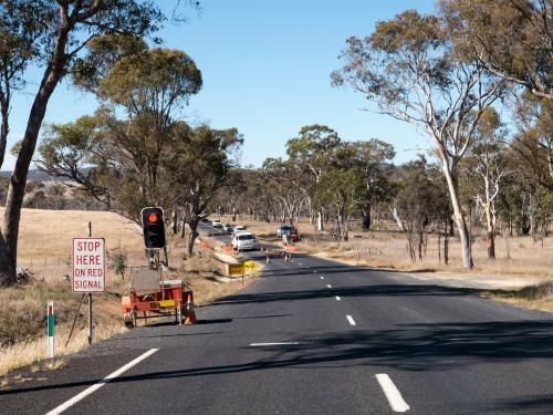 Road works with traffic lights on a country road - Australian Stock Image