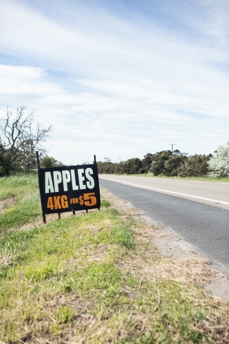 Roadside sign advertising fresh apples for sale ahead vertical - Australian Stock Image