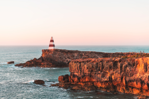 Robe Obelisk standing still at sunset while viewed walking trail - Australian Stock Image