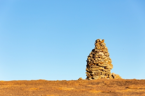 rock cairn atop granite outcrop on wheatbelt way - Australian Stock Image