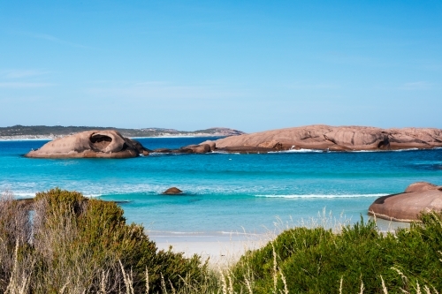 rock islands in sheltered bay - Australian Stock Image