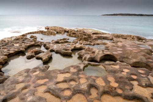 Rock pools on a grey dawn - Australian Stock Image