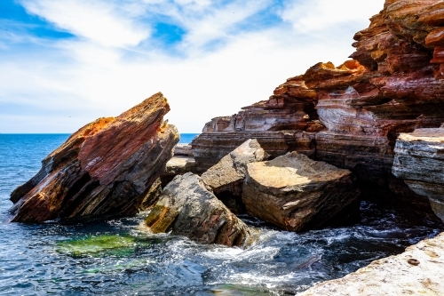 Rocky coastline with ocean and blue sky - Australian Stock Image