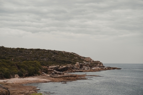 Rocky headland and waters edge at Boora Point, Malabar. - Australian Stock Image