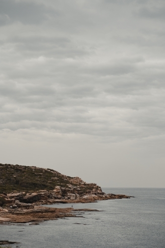 Rocky headland and waters edge at Boora Point, Malabar. - Australian Stock Image
