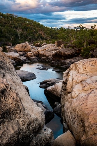 Rocky river and waterhole at sunset - Australian Stock Image