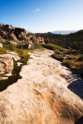 Rocky walking track in mountain range - Australian Stock Image