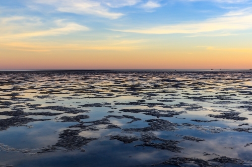 Roebuck Bay mudflats at dusk - Australian Stock Image