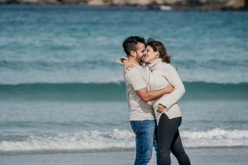 Romantic young couple on the beach. - Australian Stock Image