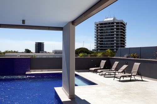 Rooftop pool and sun lounges - Australian Stock Image
