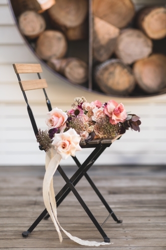 Rose Bouquet with Ribbon on Rustic Seat