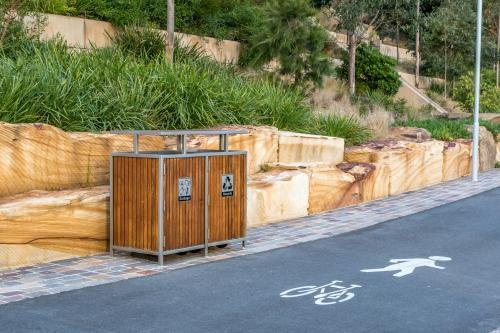 Rubbish and recycling bins along cycle/walkway at Barangaroo - Australian Stock Image
