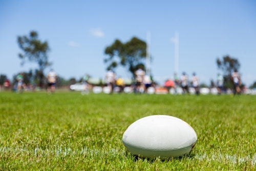 Rugby ball on with edge of the playing field during a game - Australian Stock Image