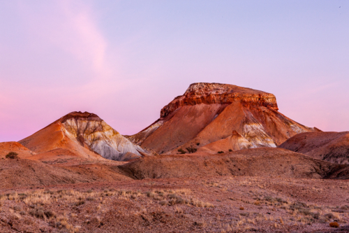 rugged hills in the Painted Desert at dusk - Australian Stock Image
