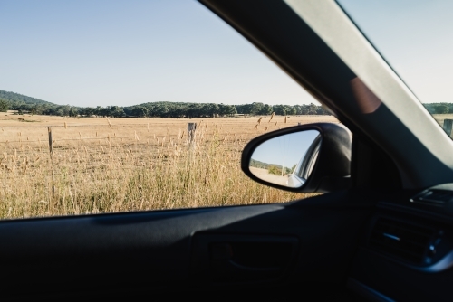 Rural country view through a car window during an afternoon weekend drive, Victoria, Australia - Australian Stock Image