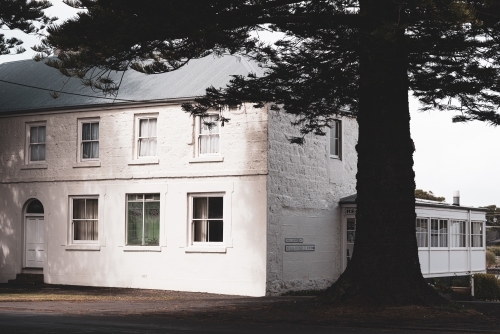 rural victorian building with old tree - Australian Stock Image