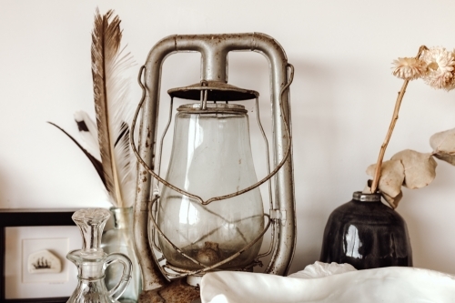 Rustic lamp among other decorative objects