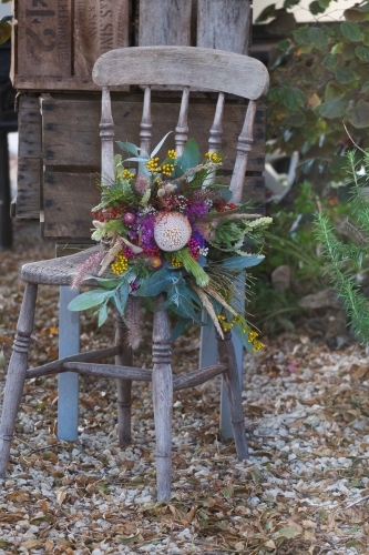 Rustic setting with wildflowers on chair