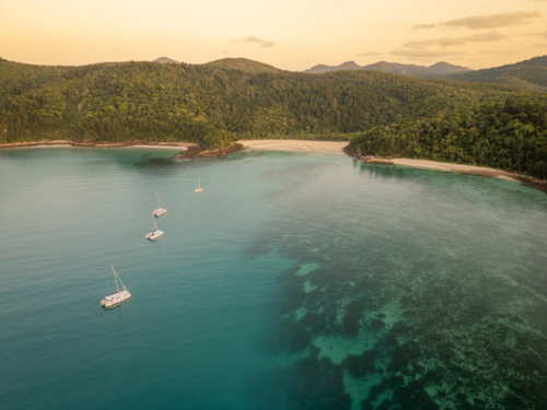 sailing boats in calm water near islands - Australian Stock Image