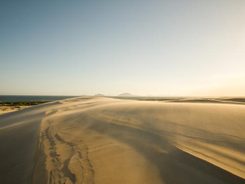 Sand blowing across a sand dune - Australian Stock Image
