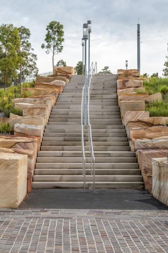 Sandstone stairs at Barangaroo, showing layered stone steps and clean architectural lines. - Australian Stock Image