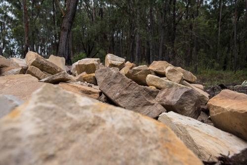 Sandstone blocks with trees in background