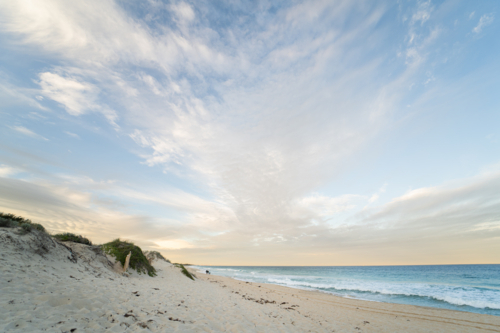 Sandy path leading through coastal dunes to ocean at Scarborough Beach, Perth, Western Australia - Australian Stock Image