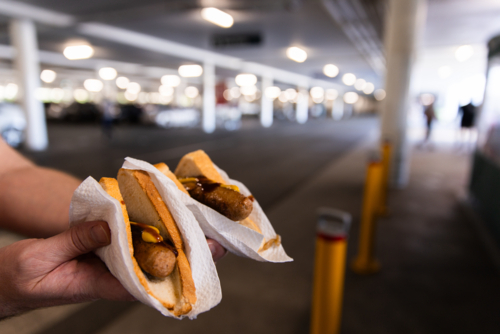 sausage sizzle fundraising sausages with sauce and mustard - Australian Stock Image