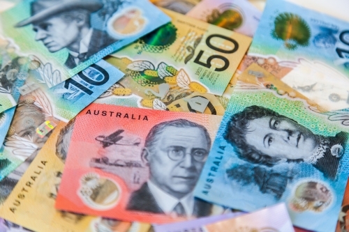 Scattered pile of australian notes in cash five dollars to fifty all new notes - Australian Stock Image