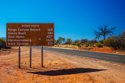 Scenic Route road sign directing towards Uluru and Kings Canyon in the Northern Territory, Australia - Australian Stock Image