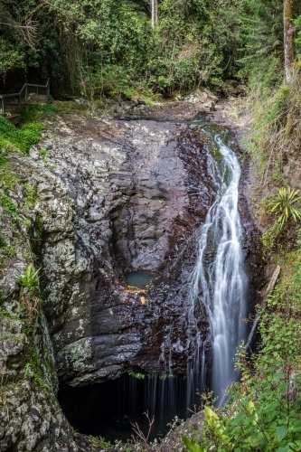 Scenic view of water flowing into underground cave - Australian Stock Image
