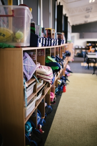 School bags on shelves in a classroom - Australian Stock Image
